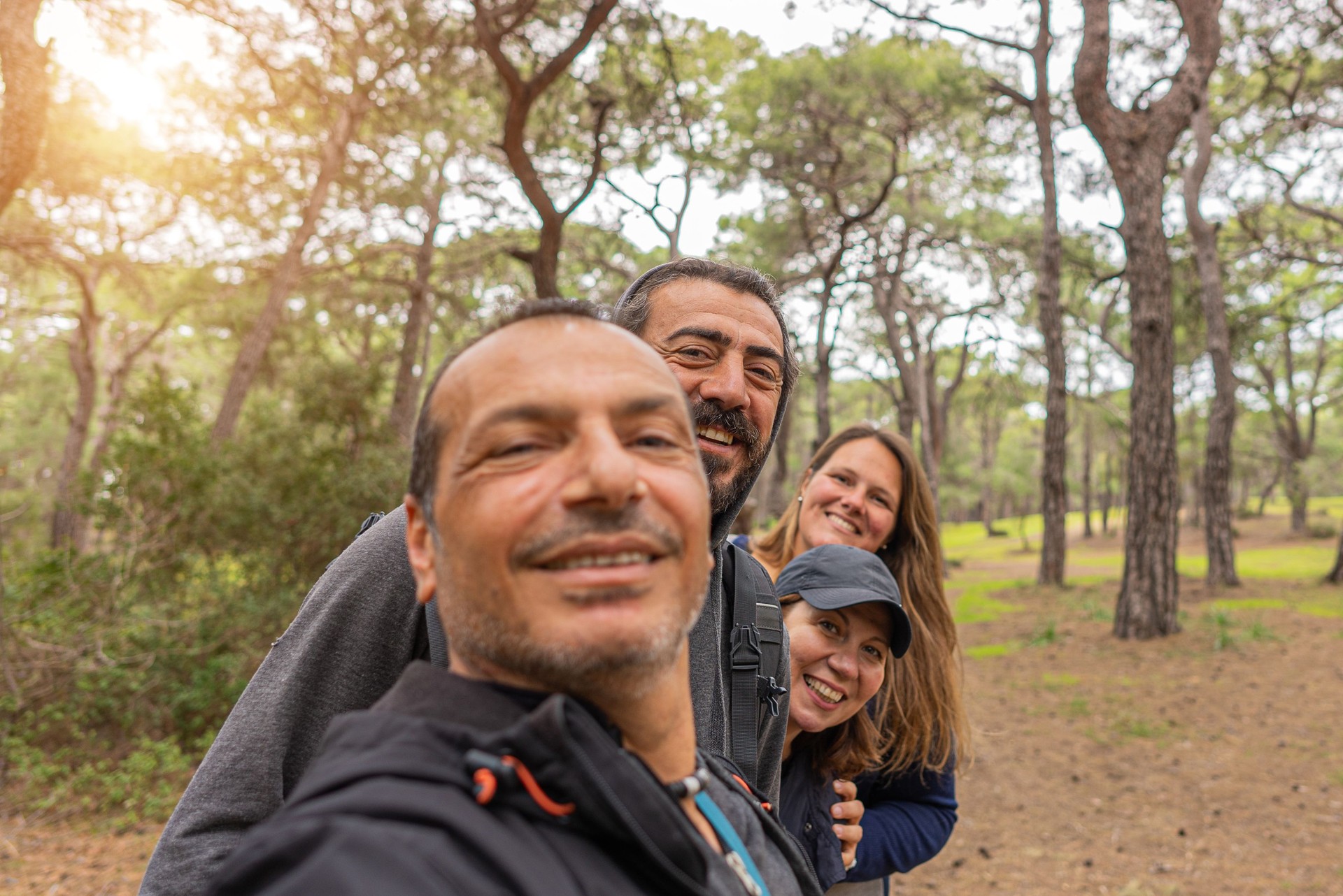 Group Of Friends Posing For Selfie in Forest.